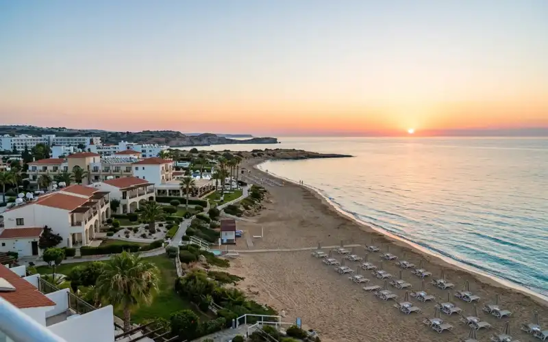 Golden sunrise illuminates the sandy shores of Protaras, perfect for a family beach vacation